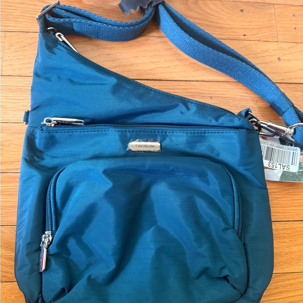 Travelon women’s blue crossbody anti theft bag